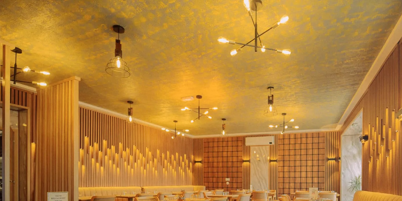 Contemporary restaurant interior with layered warm lighting